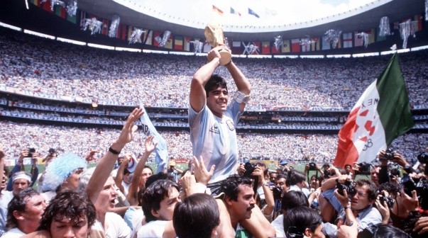 Sport. Football 1986 World Cup Final. Azteca Stadium, Mexico. 29th June, 1986. Argentina 3 v West Germany 2.  Argentina's Diego Maradona proudly holds aloft the World Cup trophy amongst masses of fans and photographers.-Not Released (NR)