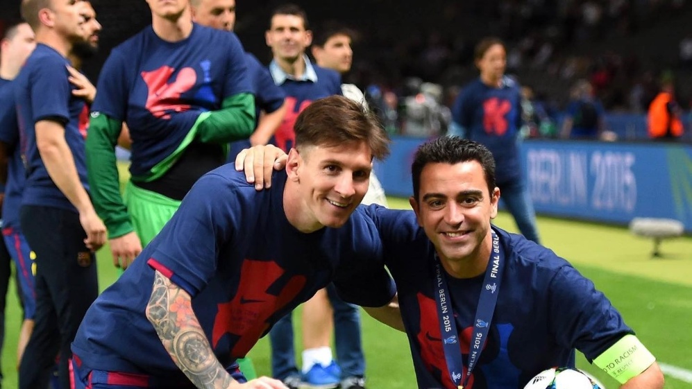 Lionel Messi y Xavi Hernández en la celebración de la Champions League 2014/15